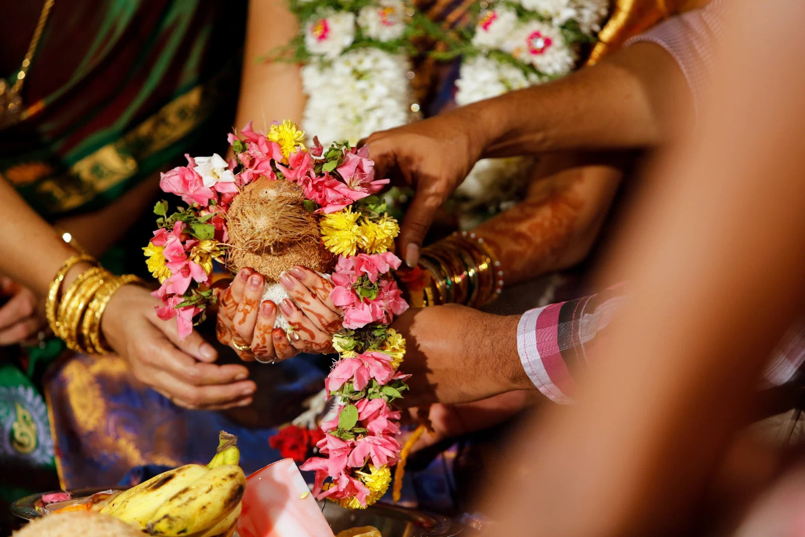 Families taking part in a shared wedding ritual
